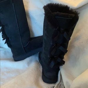 UGG black lace up in back boots.